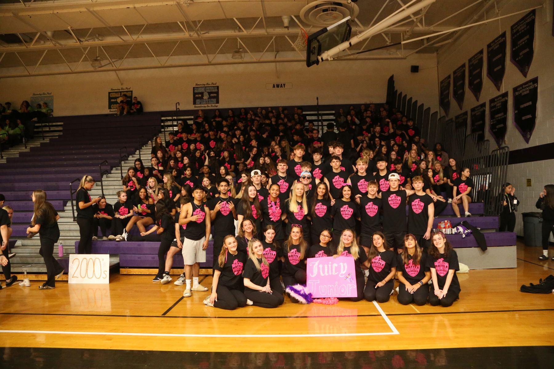 Juniors cheering in the bleachers at Battle of the Classes